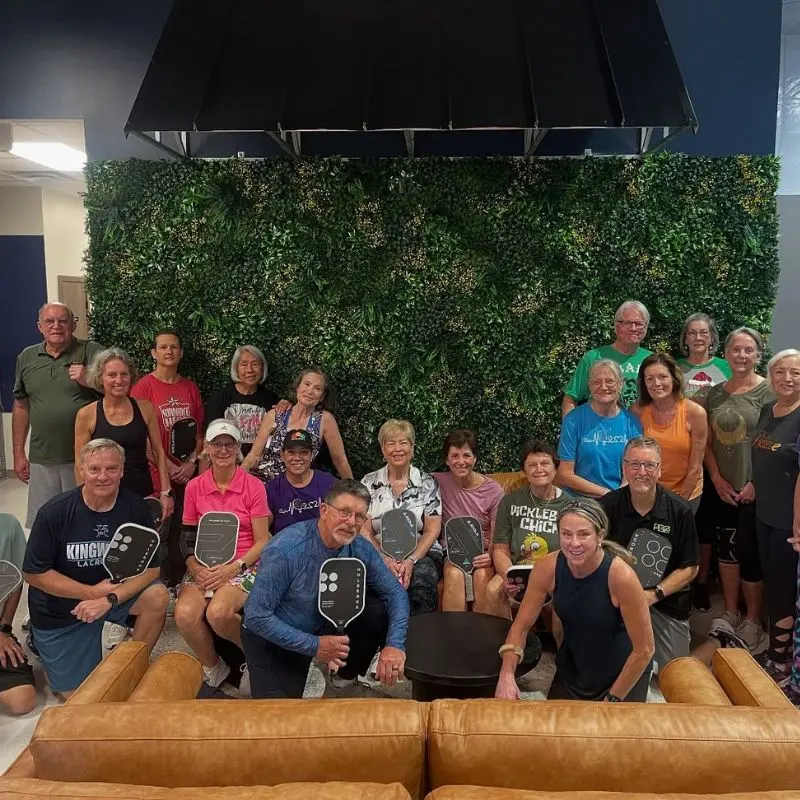Players in front of the living wall